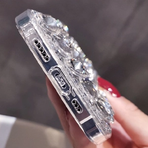 Detail showing precise side cutouts and sparkling crystal rhinestones on the phone case