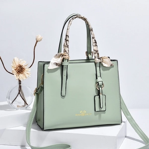 Green PU leather handbag with silk scarf handle and adjustable long shoulder strap