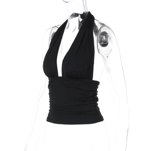 Detail of black halter deep V-neck top with pleated waist and stretchy fabric