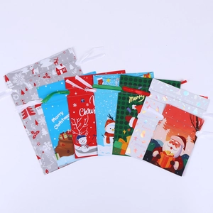 Assorted 3D drawstring Christmas gift bags with festive patterns and foil finish