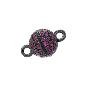 Detailed view of spherical magnetic clasp with purple crystals and gun black finish