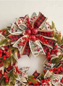 Close-up of 50cm Christmas wreath with berries, checkered ribbons and warm LED lights