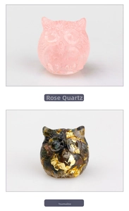 Detail of owl figurines crafted from rose quartz and tourmaline with gold foil leaf