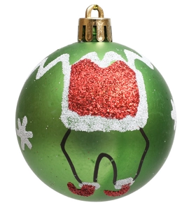 Detailed view of green Christmas ball with red glitter elf pattern and white snowflakes