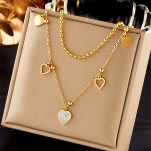 Double-layered gold titanium steel necklace with heart pendants and crystal accents