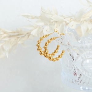 Retro 18k gold plated stainless steel U-shaped beaded hoop earrings on glass