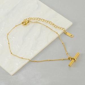 Detailed top view of 18K gold titanium steel T-bar chain bracelet with beads