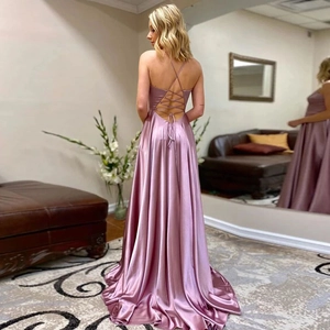 Detailed back view of a satin maxi dress featuring elegant cross-strap backless design