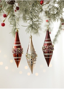 Detail of luxury red and champagne Christmas finial ornaments with hand-beaded sequins
