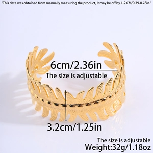 Detail view of gold leaf pattern cuff bracelet with size measurements and 32g weight