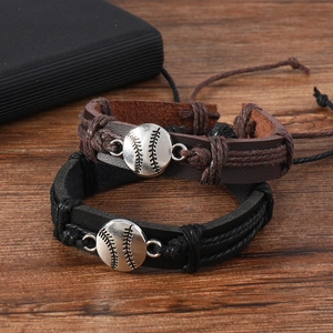 Detail view of adjustable black and brown braided leather bracelets with baseball charms