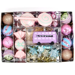 Pink and purple Christmas ornament set with candy pendants and London bus in a silver box