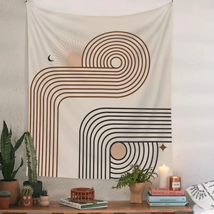 Detail of Bohemian tapestry with sun and moon pattern on a textured white wall