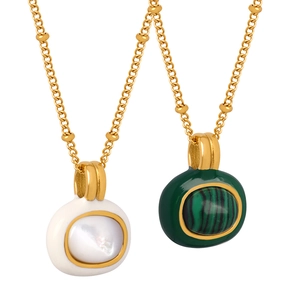 Elegant gold necklaces with white mother-of-pearl and green malachite oval pendants