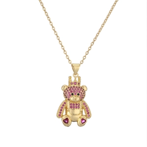 Golden bear pendant necklace with crown and pink crystals on an O-chain link