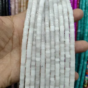 Macro shot of cylindrical white natural stone spacer beads for DIY jewelry making accessories