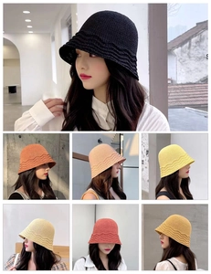 Detailed grid showing woven bucket hats in various colors with wavy brim designs