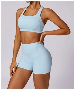 Detail of light blue two-piece yoga set with racerback bra and high-waist shorts