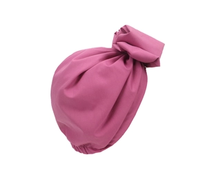 Detailed view of pink turban hat featuring a decorative twist knot and pleated fabric