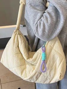 Quilted cream hobo bag with large capacity and colorful rope knot pendant accessory