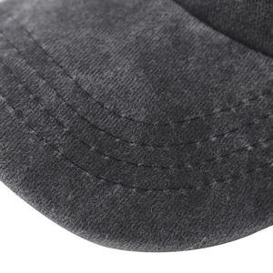 Close-up of three rows of precise stitching on washed grey canvas baseball cap brim