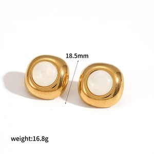 Detail of 18.5mm gold vintage disc earrings with white gemstone and 16.8g weight