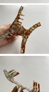 Large acetate shark hair claw with blue leopard marble texture and sturdy metal spring