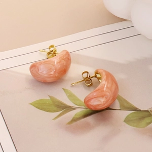 Pink and white marble teardrop stainless steel stud earrings with golden metal accents