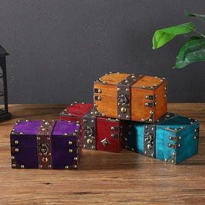 Set of four vintage wooden jewelry storage boxes with metal clasps in various colors