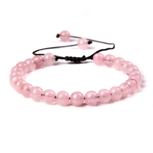 Detail of pink natural stone beaded bracelet with adjustable black braided cord