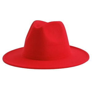 Classic red felt fedora hat with a wide brim and teardrop crown on white background