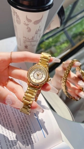 Detail of gold women's watch with rhinestone bezel and roman dial in a lifestyle setting