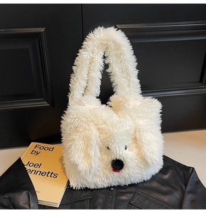 Detail of a white plush dog-shaped tote bag showing soft faux fur and cute facial features