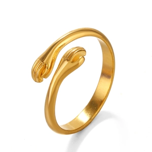 Minimalist golden hugging hands open ring in stainless steel with a polished finish