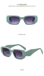 Detail view of square light green sunglasses with geometric temples and grey lenses