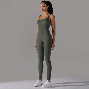 Detailed texture of dark green ribbed fabric on seamless bodycon sports jumpsuit