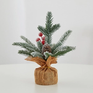 Mini PE tabletop Christmas tree with artificial snow, red berries and pinecones in burlap base