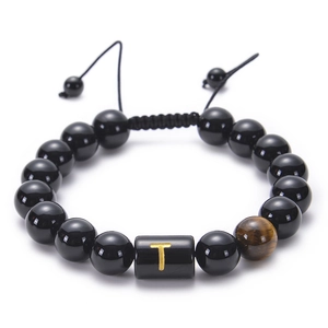 Close-up of adjustable obsidian bead bracelet with Tiger Eye stone and letter T charm