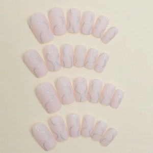Pink rectangular press-on nails with silver glitter wavy lines and matte finish