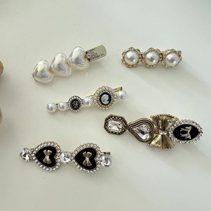 Set of 5 pearl and rhinestone hair clips featuring heart, bow, and portrait designs