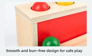 Detail of Montessori wooden toy showing smooth rounded edges and colorful balls for safe play