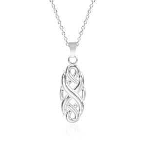 Macro shot of silver witch knot pendant with polished celtic design and reflection