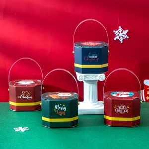 Octagonal Christmas candy boxes in red, green and blue with festive holiday patterns