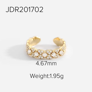Detail of 18K gold plated brass ring showing 4.67mm width and cubic zirconia stones