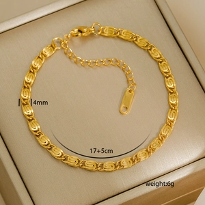 Detail of 4mm gold beaded anklet with lobster clasp and extension chain on display box