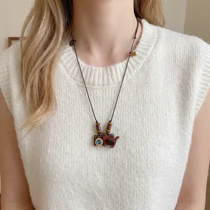 Artistic cat camera pendant necklace with wood resin and coffee bean accents
