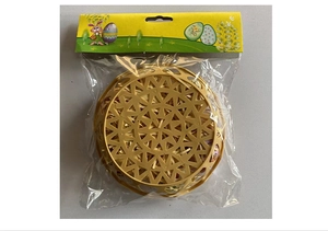 Detail of yellow woven Easter basket with paper grass in transparent OPP bag