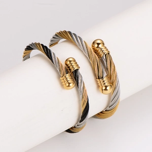 Retro stainless steel twisted cable bangles in gold, silver, and black finish combo