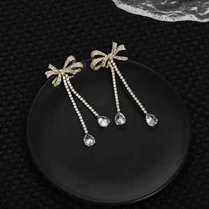 Elegant bow zircon tassel earrings with gold plating and teardrop crystal pendants