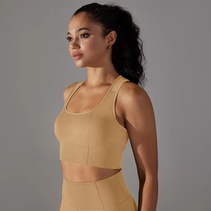 Detailed texture of seamless camel sports bra and high-waisted leggings set for gym